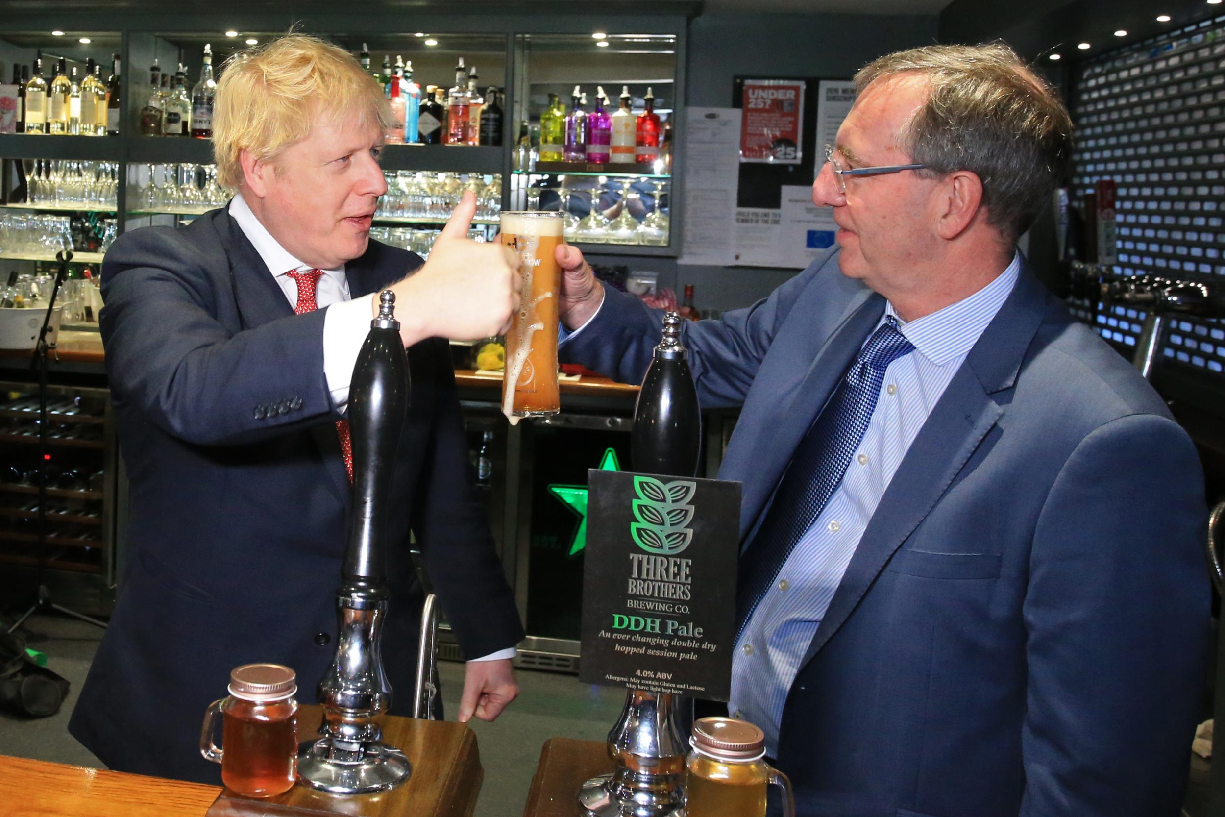 Boris Johnson toasts the newly elected MP for Sedgefield, Paul Howell, after the Conservatives’ election victory in December 2019