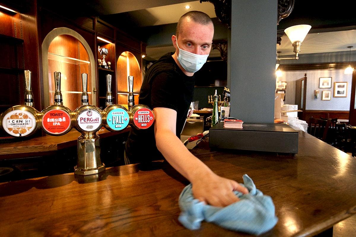 Businesses fear new Covid wave as government leaves mask rules up to shops and workplaces