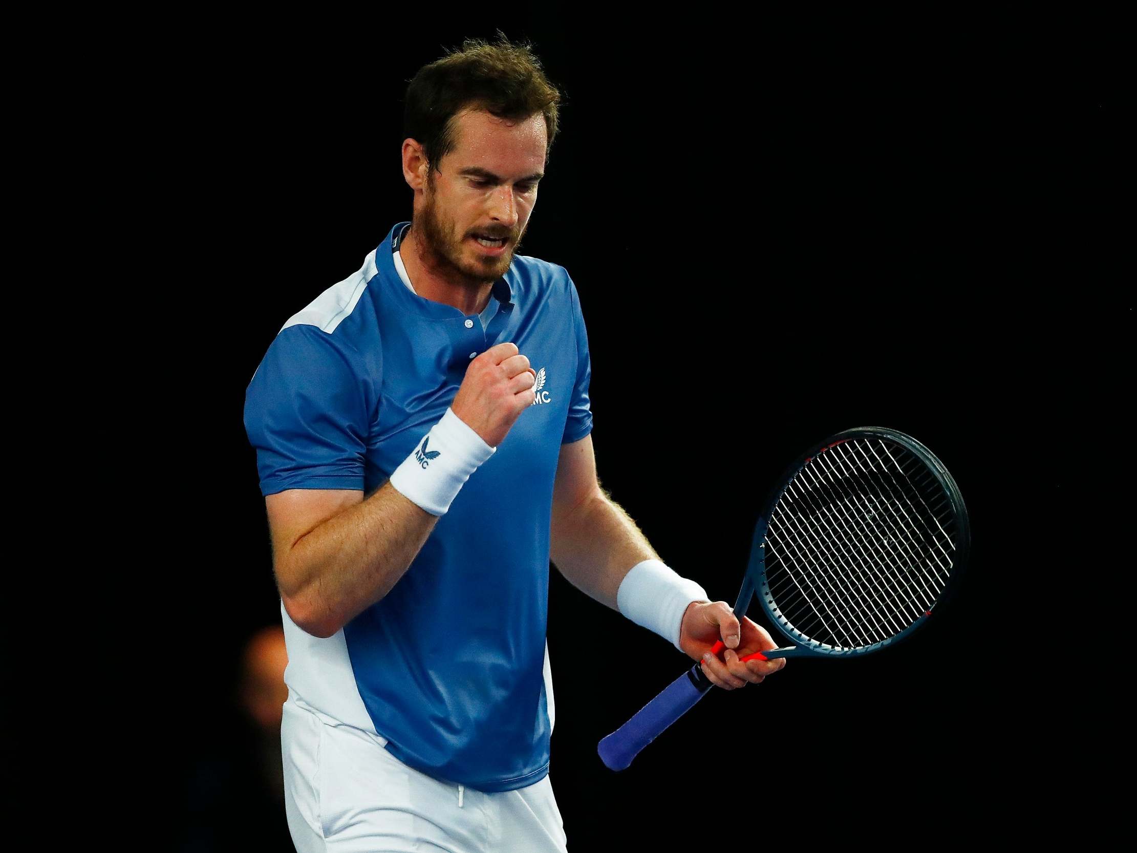 Andy Murray celebrates defeating Liam Broady