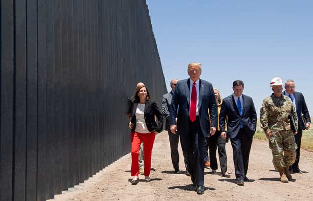 Donald Trump participates in a ceremony commemorating the 200th mile of border wall at the international border with Mexico in San Luis, Arizona