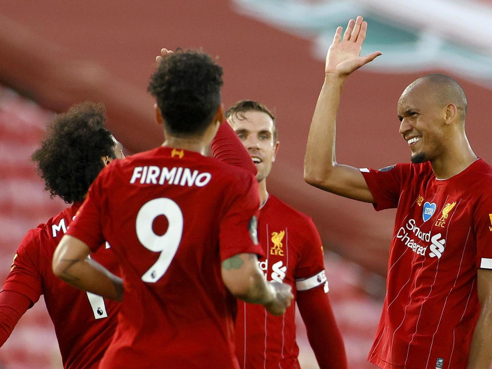 Fabinho of Liverpool celebrates with his team