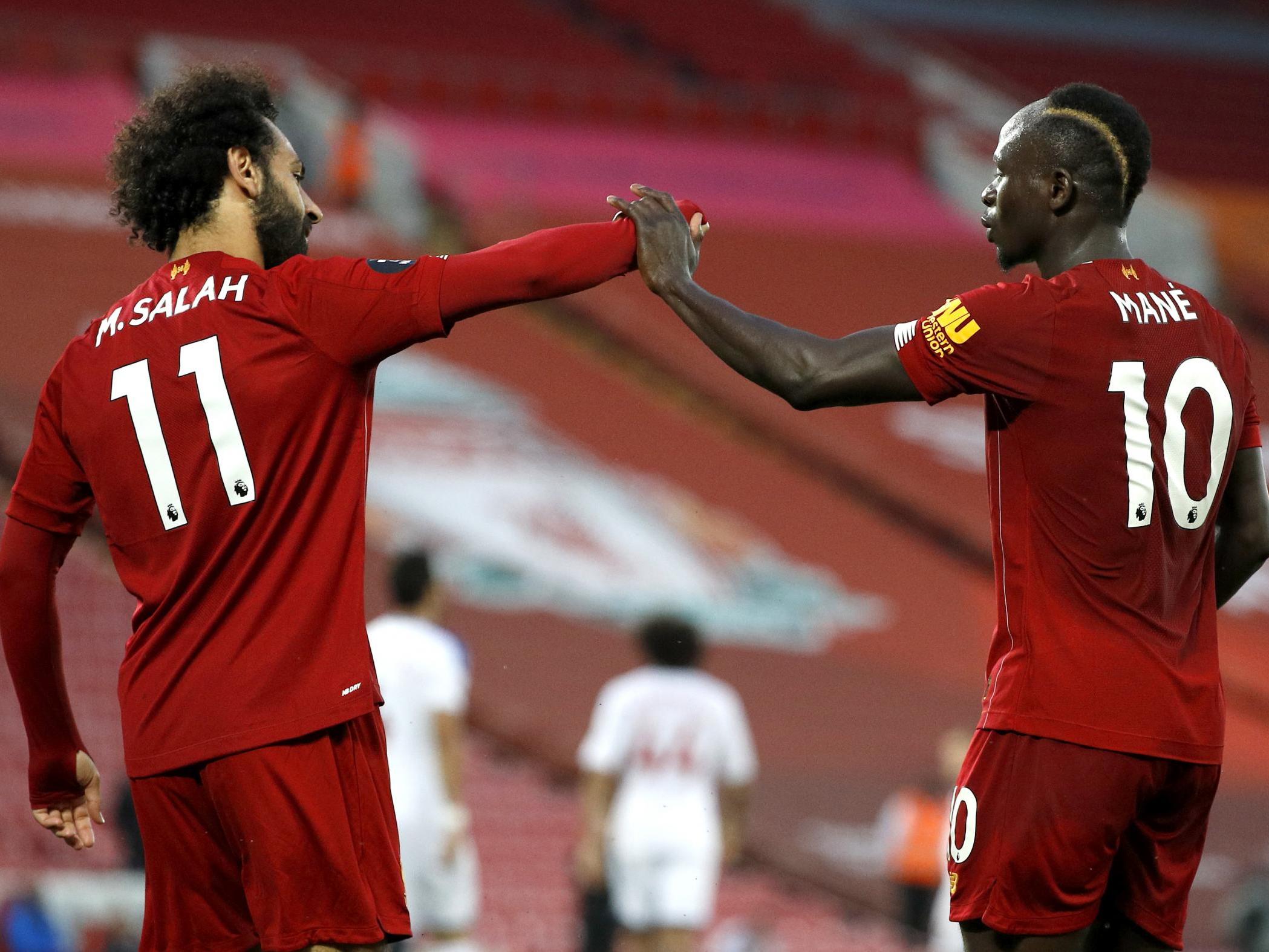 Sadio Mane of Liverpool celebrates with Mohamed Salah