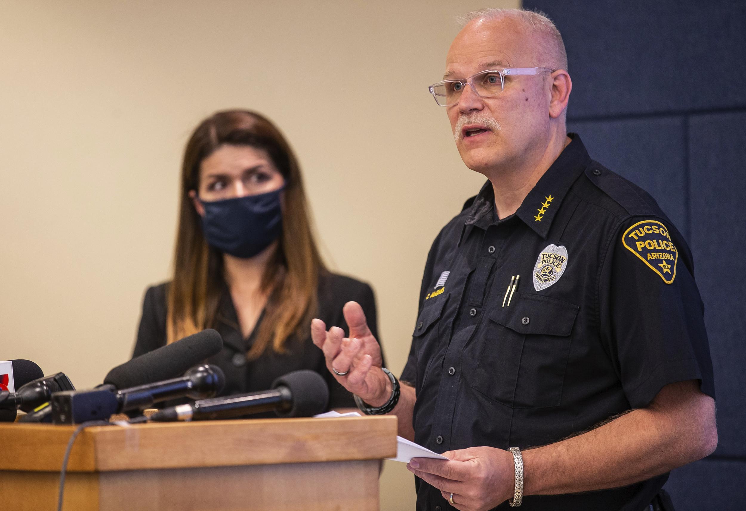 Tucson police chief Chris Magnus (right) speaks as Mayor Regina Romero listens during a press conference in which he offered his resignation