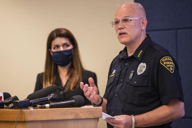 Tucson police chief Chris Magnus (right) speaks as Mayor Regina Romero listens during a press conference in which he offered his resignation