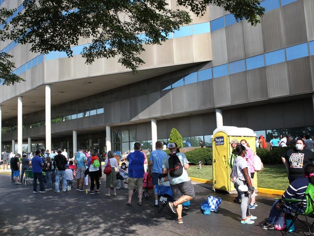 Hundreds of unemployed Kentucky residents wait in long lines outside the Kentucky Career Center for help with their unemployment claims on 19 June, 2020 in Frankfort, Kentucky