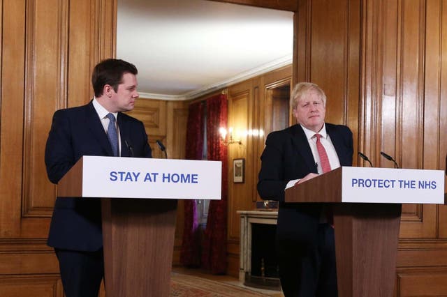 <p>Then cabinet colleagues Robert Jenrick and Boris Johnson at a Covid press conference in 2020</p>