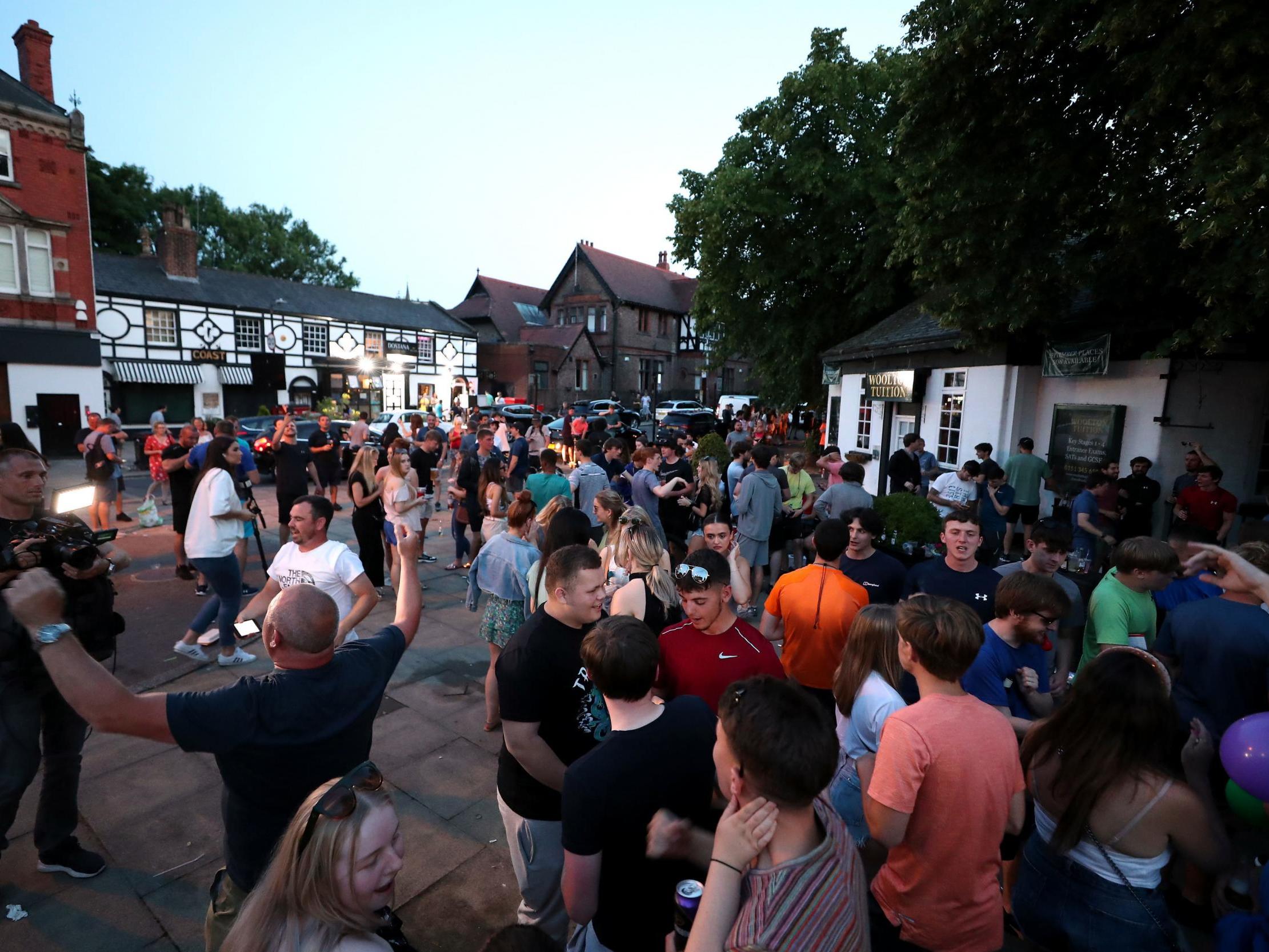 Liverpool fans gather in the streets near Anfield