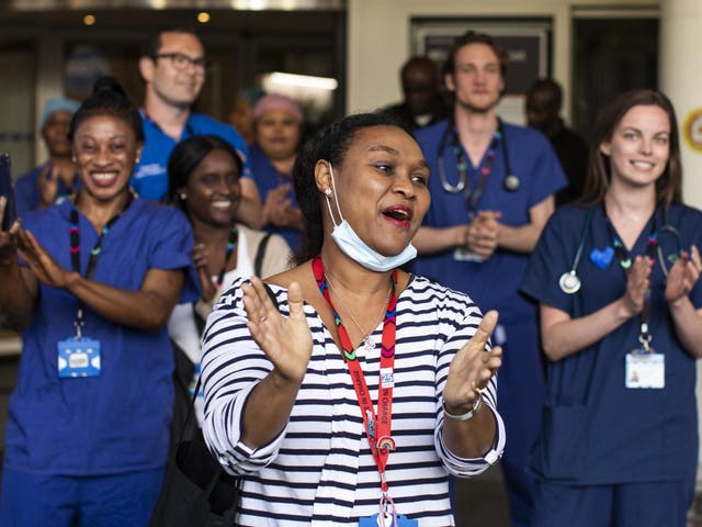 NHS staff and members of the public take part in the weekly 'Clap for Our Carers' event at Chelsea & Westminster Hospital on 28 May 2020 in London, United Kingdom