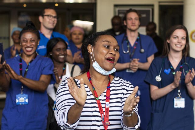 NHS staff and members of the public take part in the weekly 'Clap for Our Carers' event at Chelsea & Westminster Hospital on 28 May 2020 in London, United Kingdom
