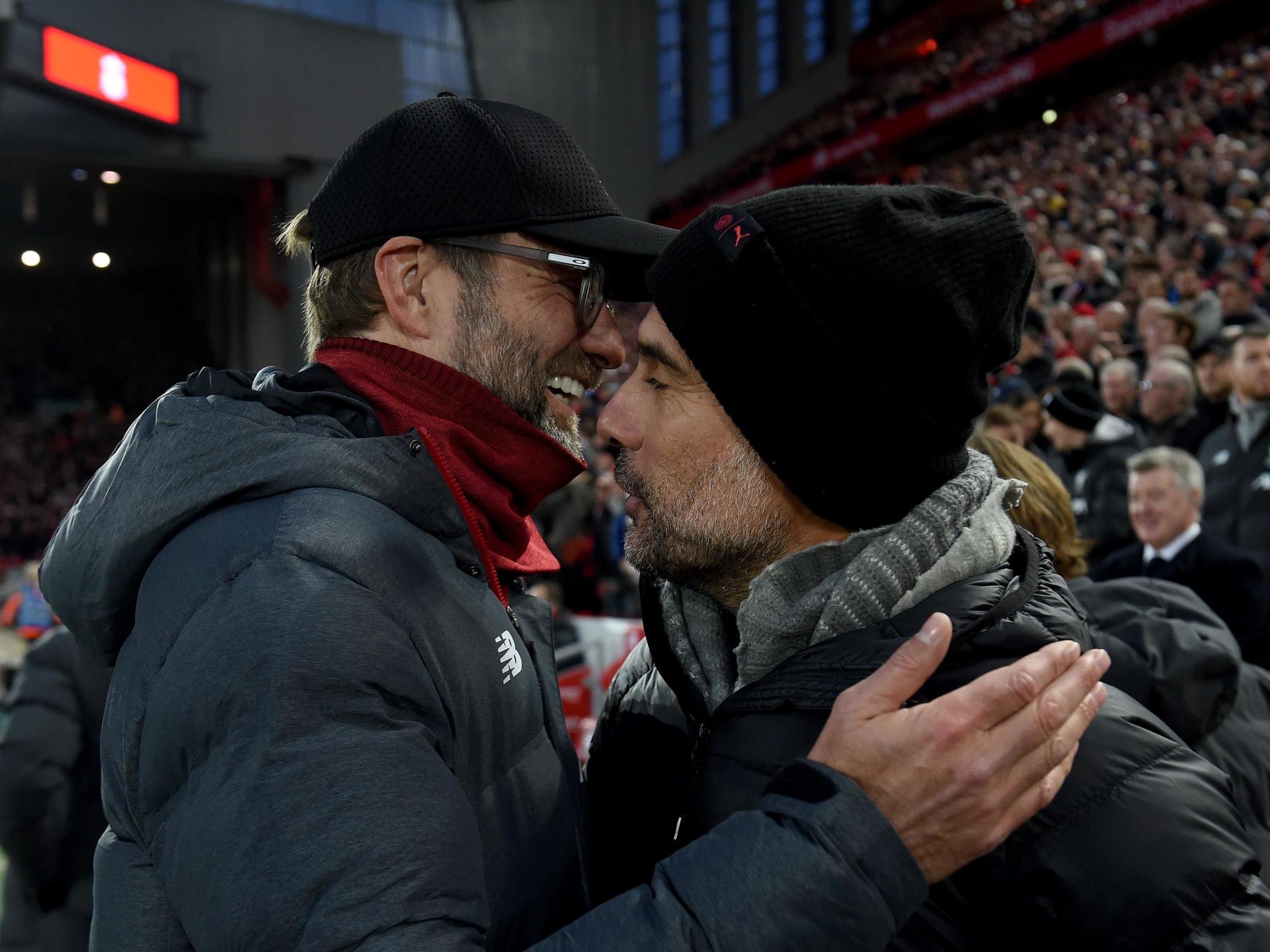 Klopp and Guardiola embrace at Anfield