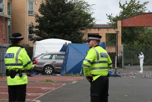 Police at the murder scene in Manchester