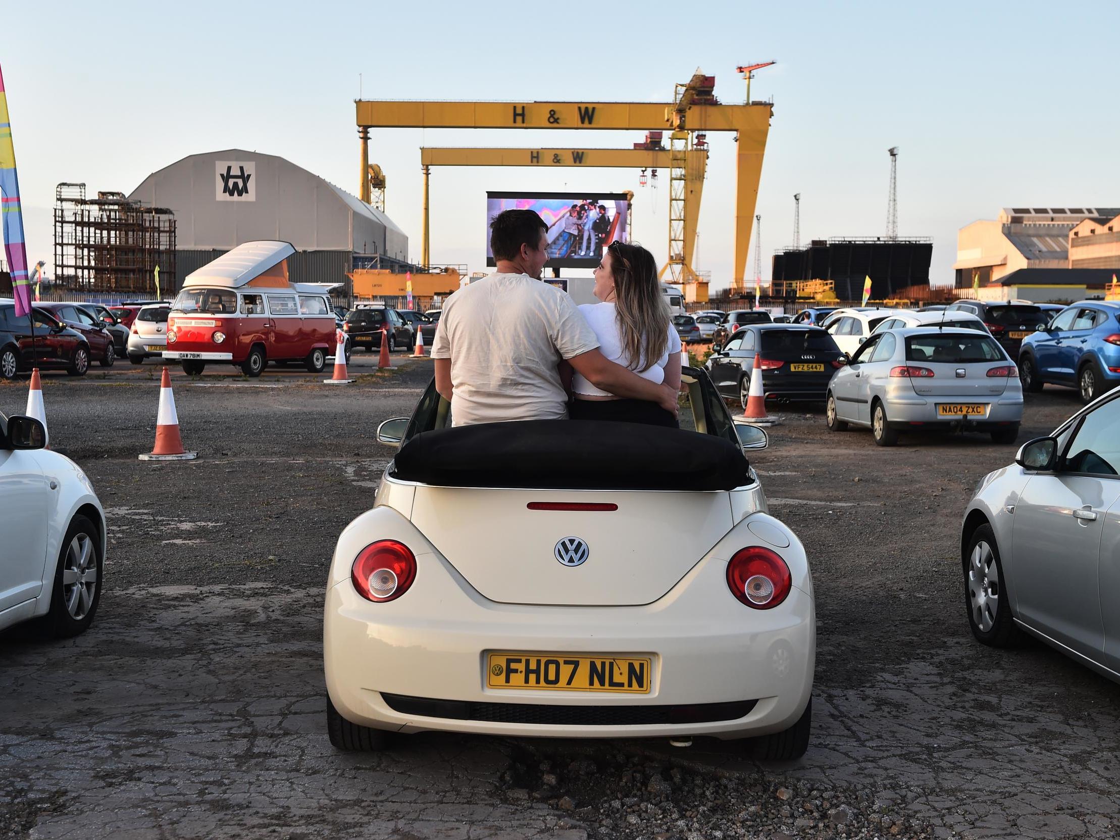 Movie goers watch ‘Grease’ on the big screen in the Titanic Quarter in Belfast