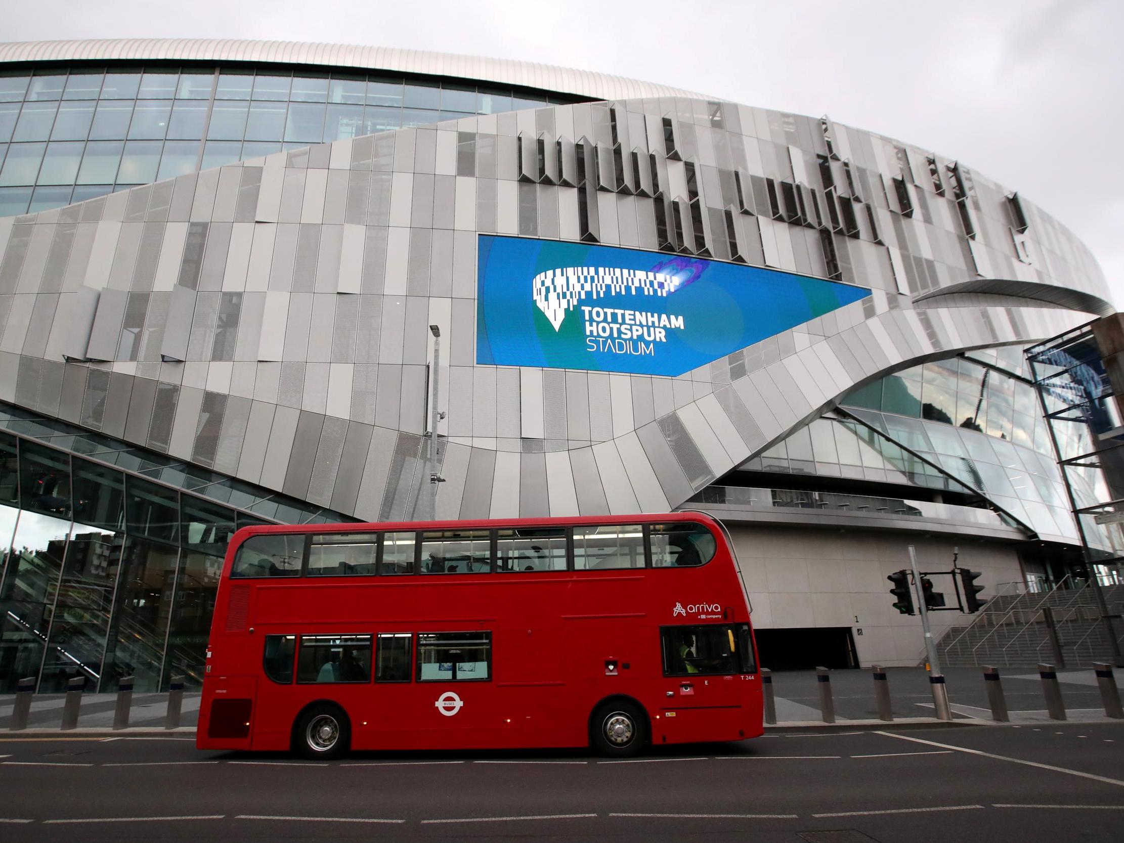 A bus passes Tottenham Hotspur Stadium, London, on 19 June, 2020.