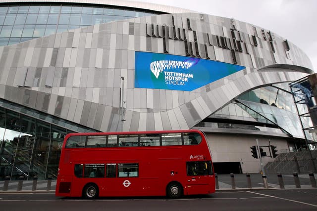 A bus passes Tottenham Hotspur Stadium, London, on 19 June, 2020.