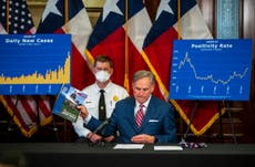 Texas puts reopening on hold as cases surge to record numbers