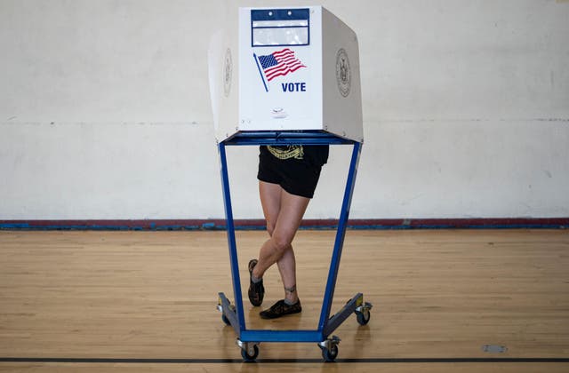 A voter casts his ballot. AFP via Getty Images