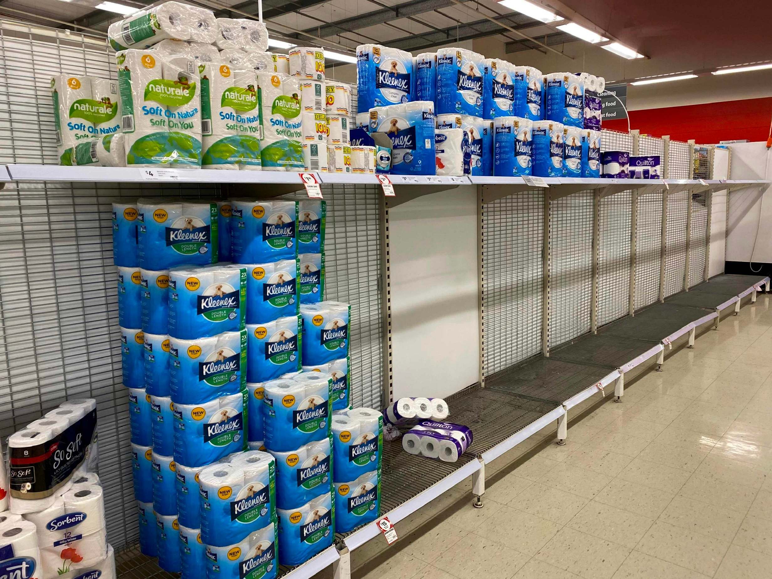 Near-empty shelves of toilet paper are seen at a supermarket in a Melbourne, Australia last week