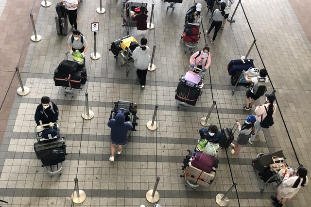 Waiting game: passengers at Heathrow airport