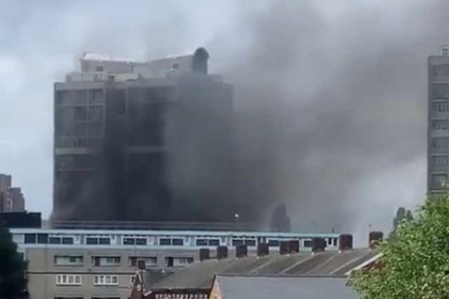 Thick smoke rising into the sky in south London from the blazing tower block