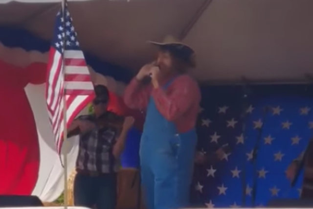 A singer, allegedly comedian Sacha Baron Cohen in disguise, performs an offensive song at a right-wing event in Washington