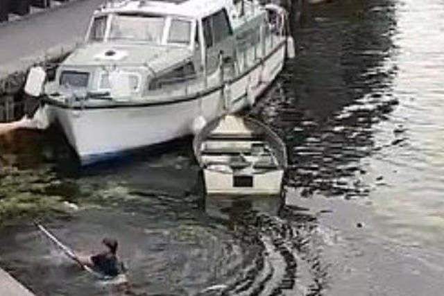 Intervening man in the canal after getting pushed in
