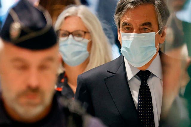 Former French Prime minister Francois Fillon and his wife Penelope Fillon arrive at the Paris' courthouse
