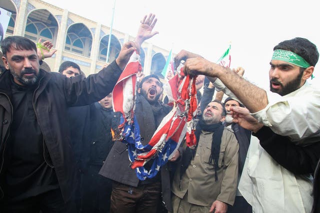 Iranians burn a US flag during a demonstration against American "crimes" in Tehran on 3 January, 2020 following the killing of Iranian Revolutionary Guards Major General Qasem Soleimani in a US strike on his convoy at Baghdad international airport