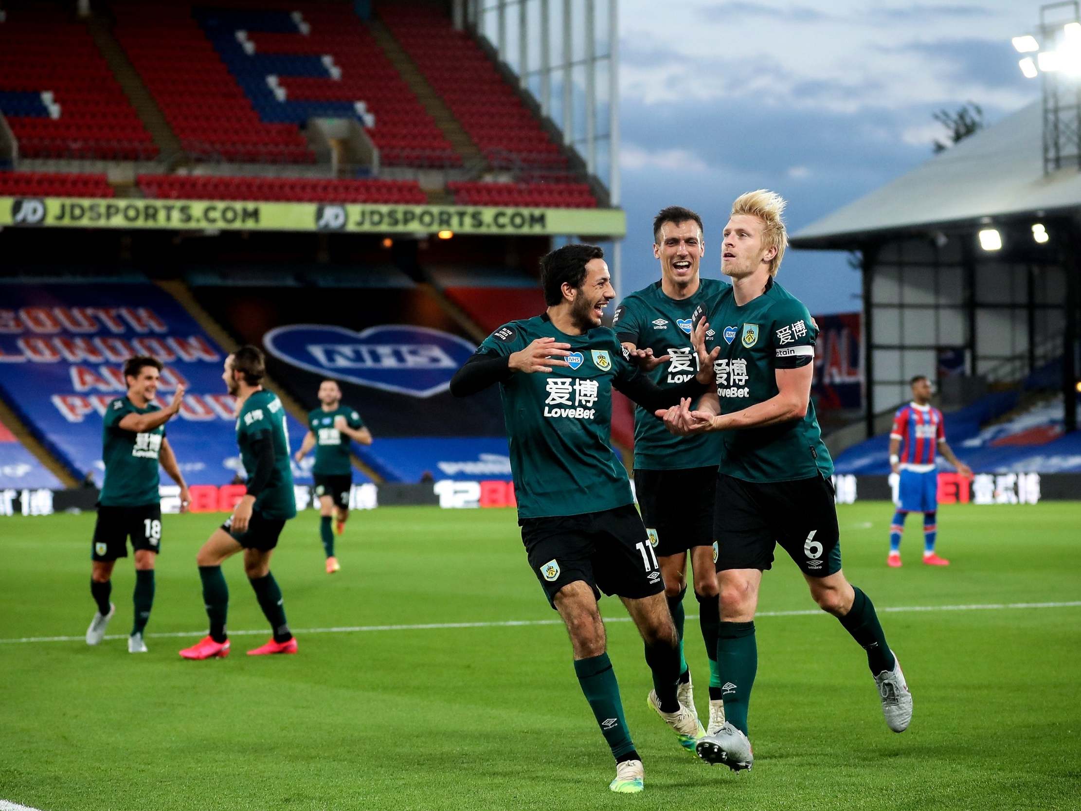 Ben Mee, right, celebrates scoring Burnley's winning goal