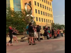 Armed riot police break up peaceful violin vigil for Elijah McClain