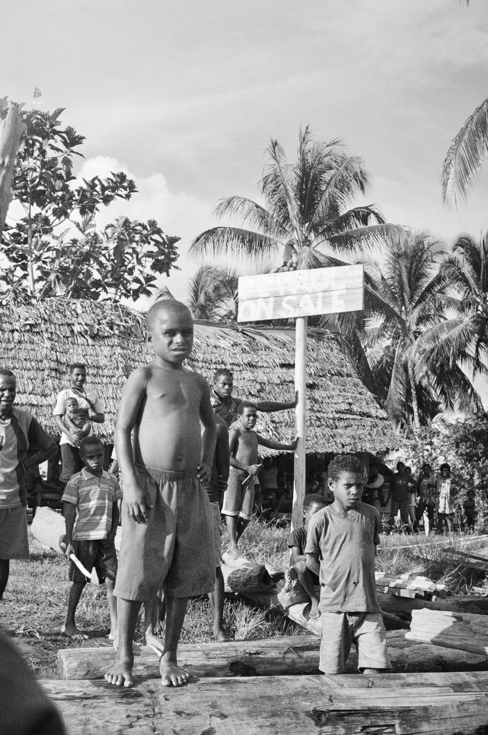 Villagers await the arrival of volunteers with suspicion and intrigue