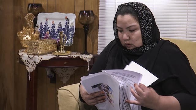 Zumret Dawut, a Uighur from China's far western Xinjiang region, holds documents. Dawut says in China, she was forcibly sterilized for having a third child after being released from a detention camp