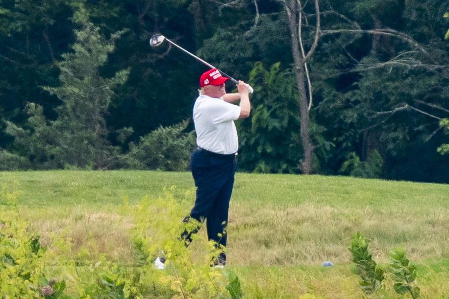 Trump's aides unable to contact him after 'white power' tweet because he put his phone away and went golfing, report says
