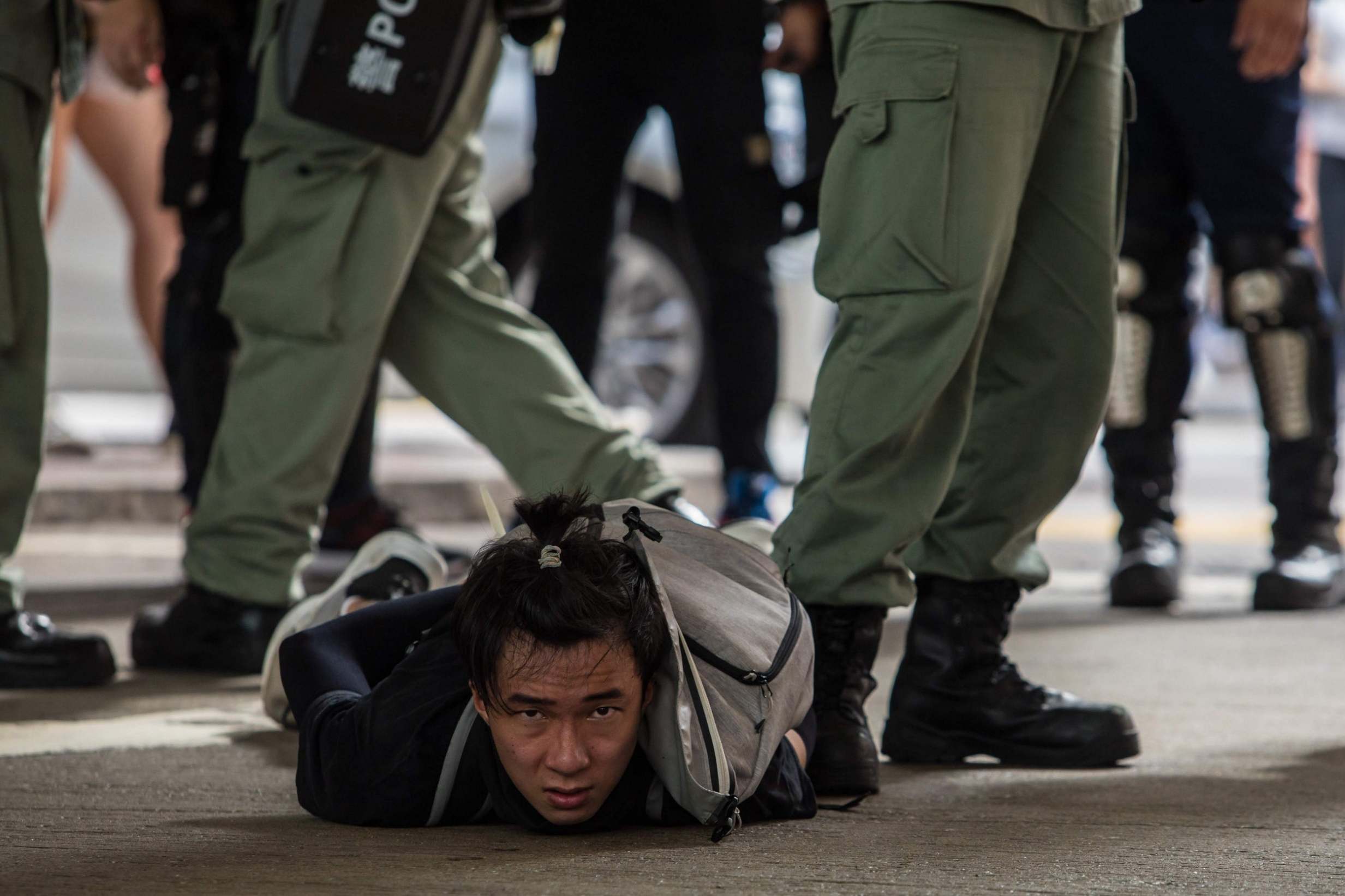 Riot police detain a man as they clear protesters taking part in a rally against the new national security law in Hong Kong (AFP/Getty)