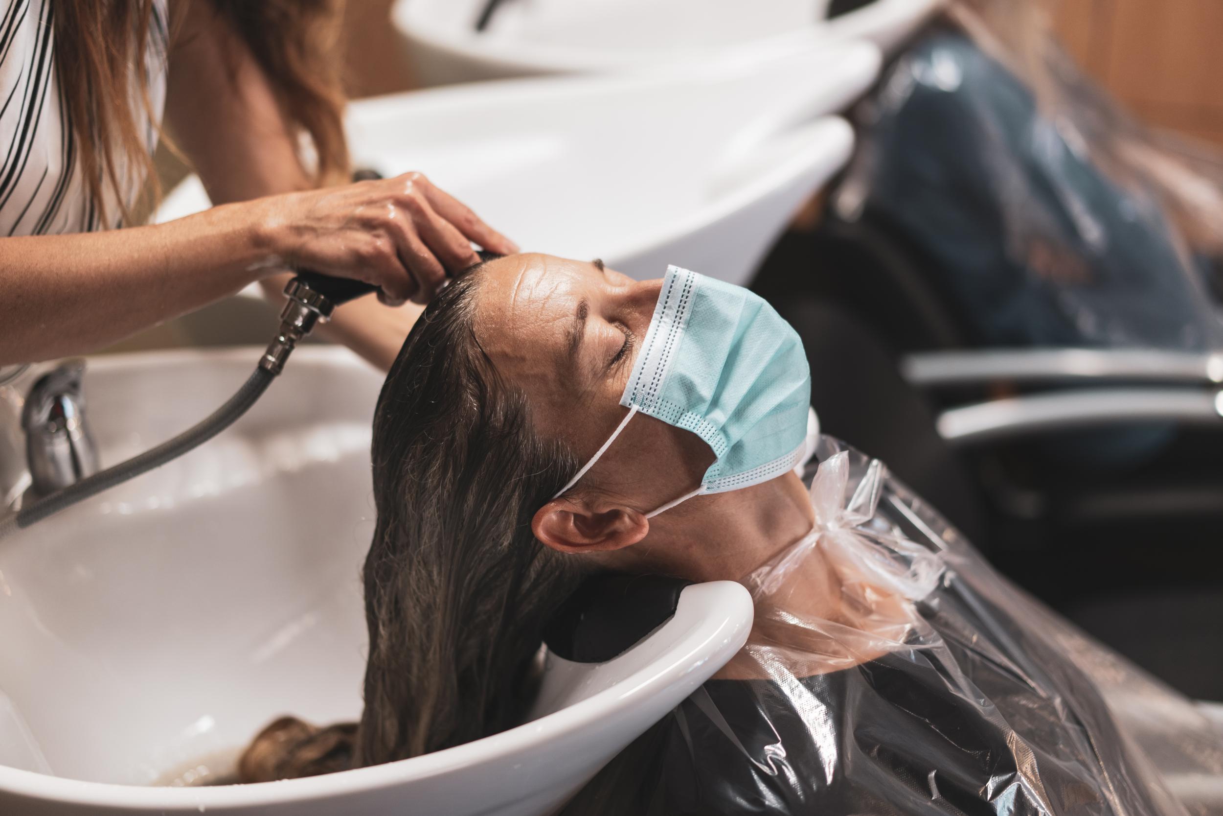 Wear a mask to the hairdressers that loops behind your ears