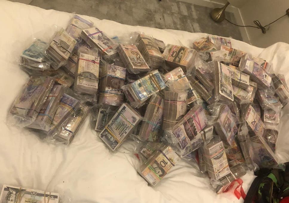 A quantity of cash seized by officers under Operation Venetic in London