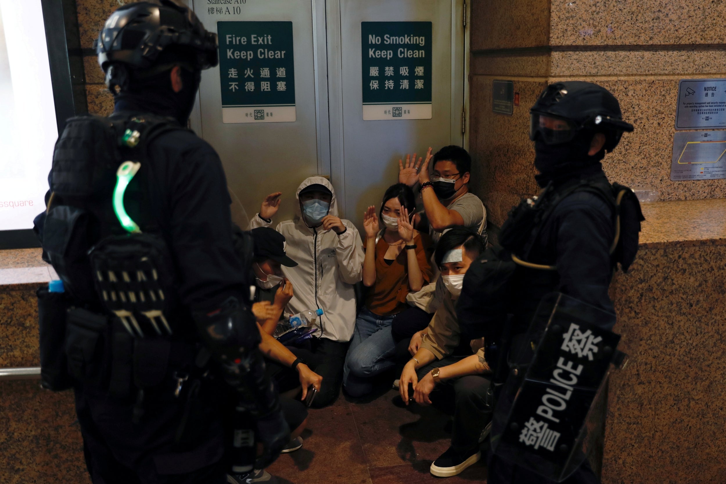 Riot police in Hong Kong detain people protesting against the new security law