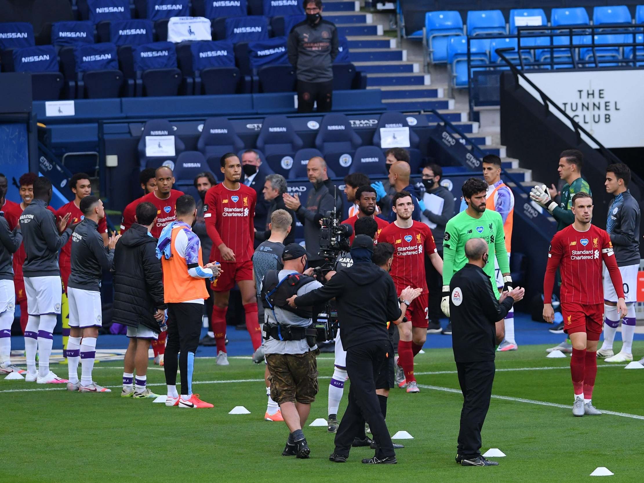 Liverpool players walk through the guard of honour
