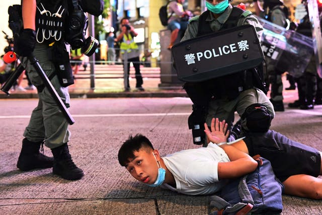 Police officers detain protesters during a rally against a new national security law on the 23rd anniversary of the establishment of the Hong Kong Special Administrative Region in Hong Kong, China, 1 July 2020.