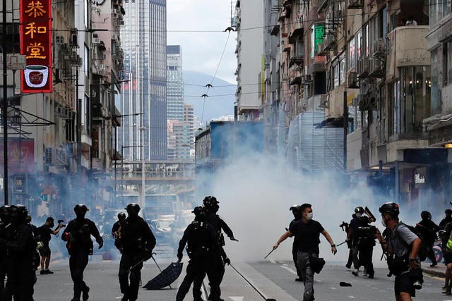 Police clash with demonstrators protesting against China’s new national security law in Hong Kong