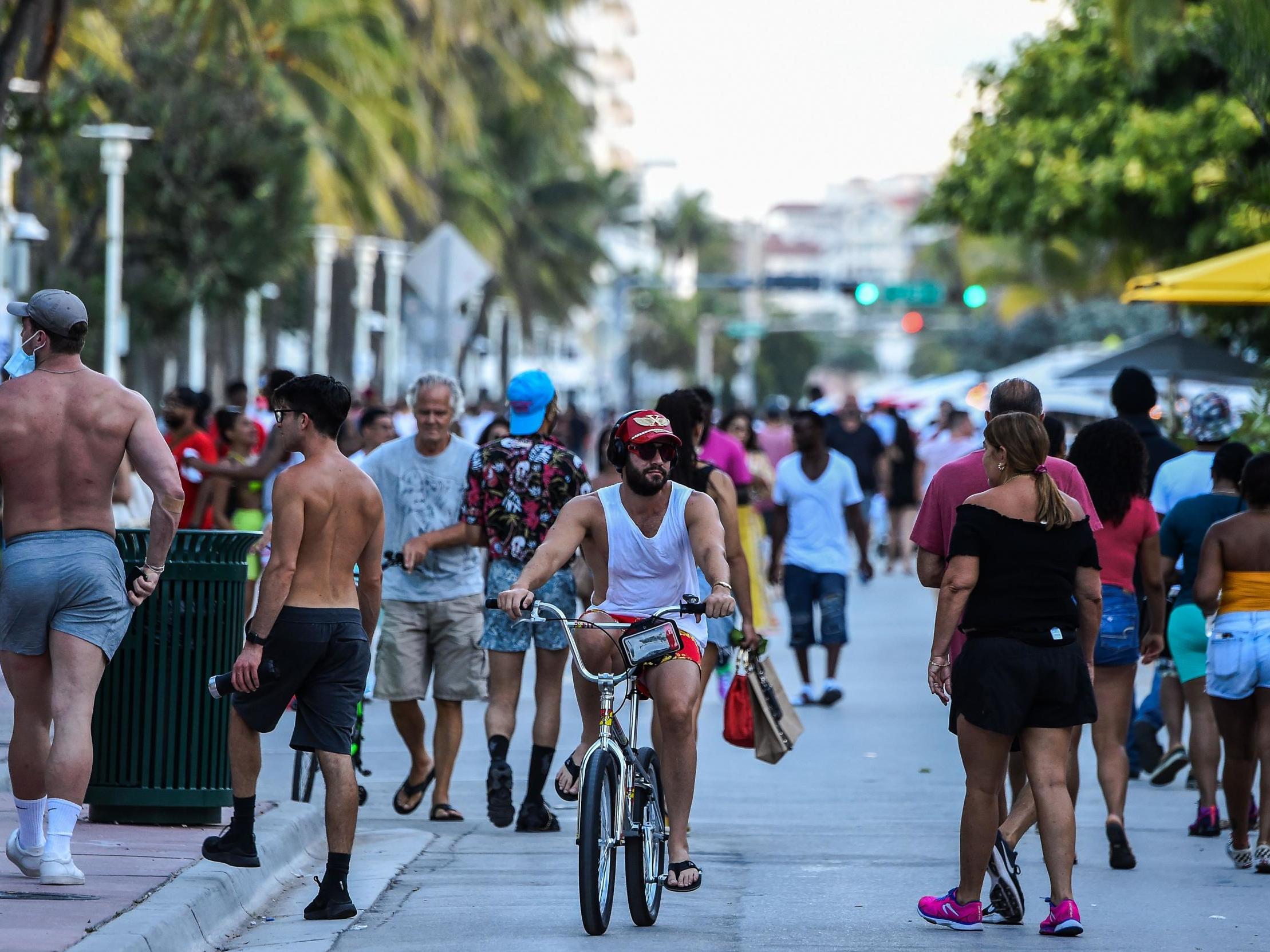 No masks on Ocean Drive in Miami Beach, where the number of cases is soaring (AFP/Getty)
