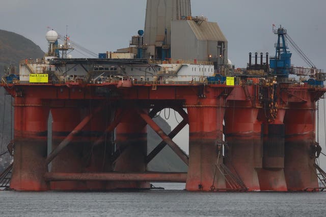 Greenpeace climbers on the oil rig in Cromarty Firth, Scotland as it was being towed out to sea