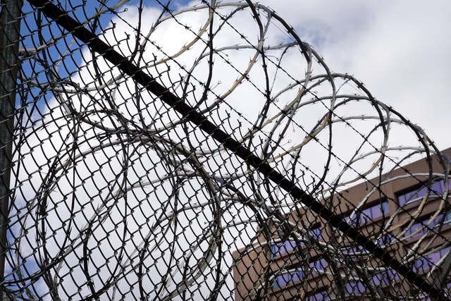 A fence surrounds the Cook County jail complex in Chicago, Illinois