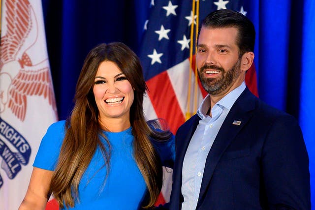 Donald Trump Jr and his girlfriend Kimberly Guilfoyle smile during a 'Keep Iowa Great' press conference in Des Moines