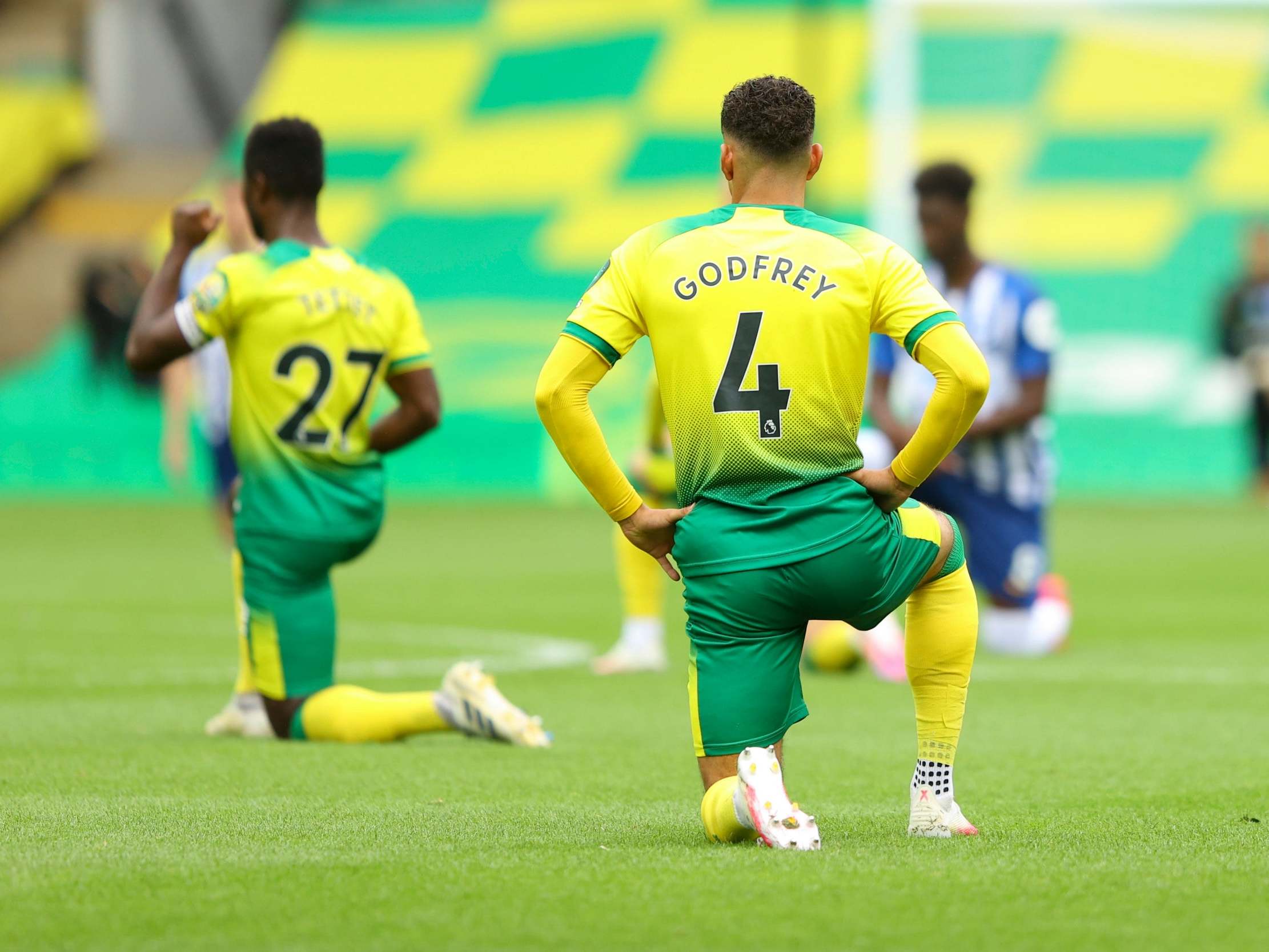 Norwich and Brighton players take a knee at the start of their Premier League match