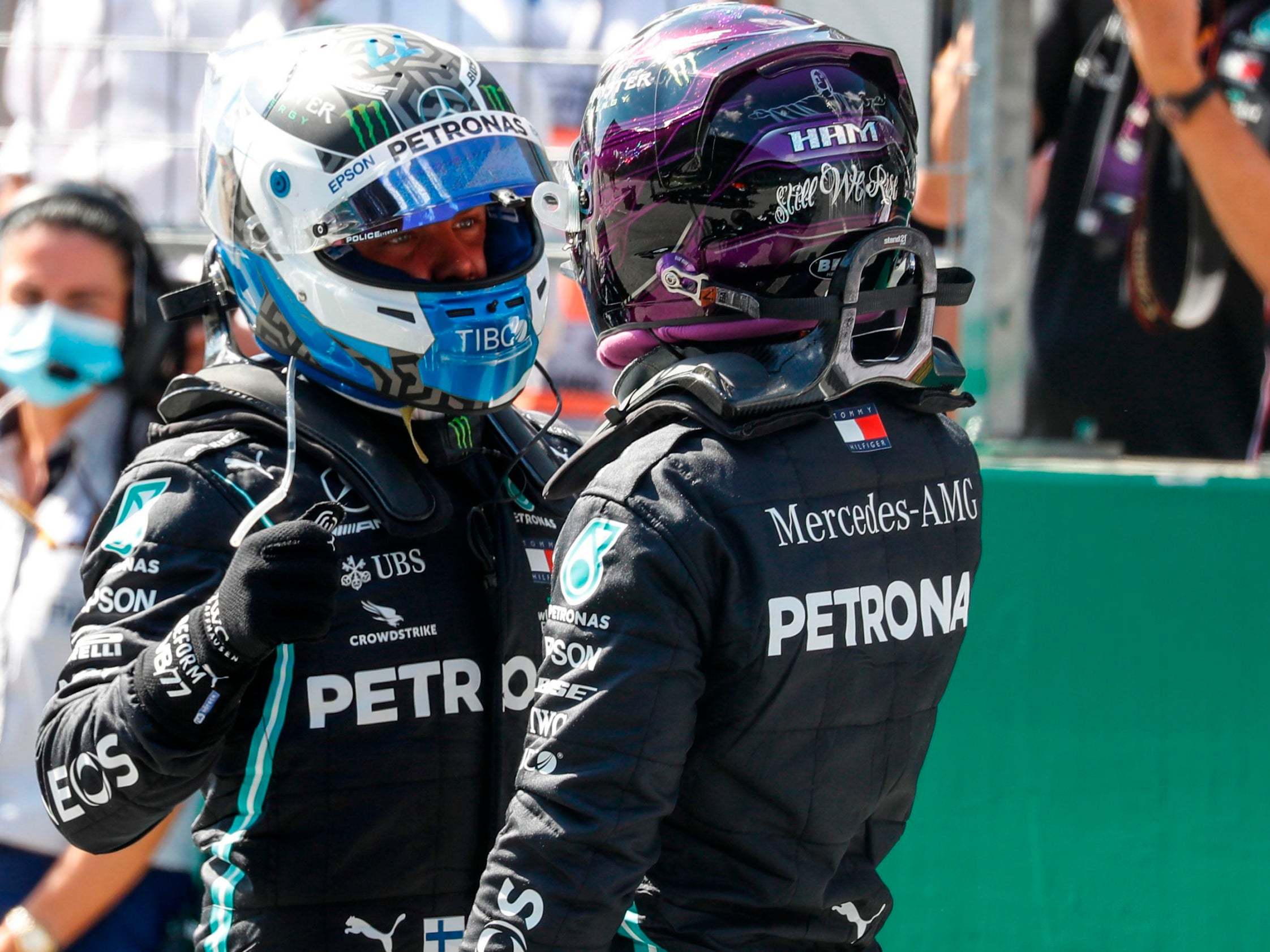 Valtteri Bottas is congratulated by Lewis Hamilton after taking pole position (AFP via Getty)