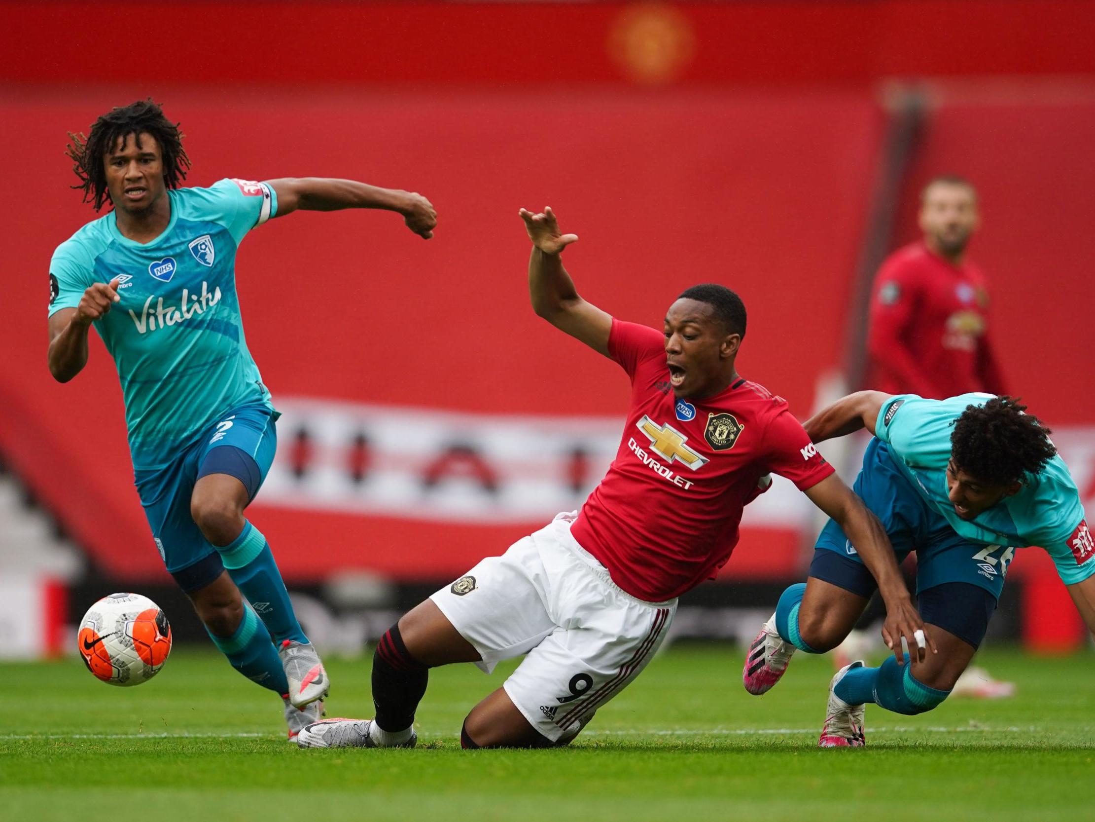 Martial is fouled by Kelly as Ake watches on