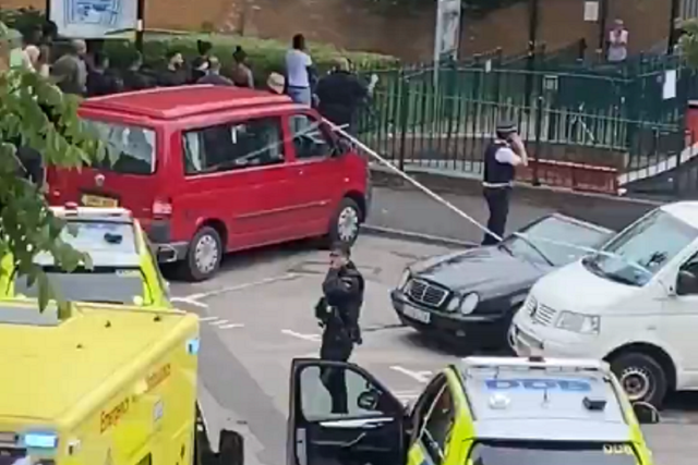 Police and paramedics at the scene of a fatal shooting in Islington, north London, where a man in his 20s died, 4 July 2020.