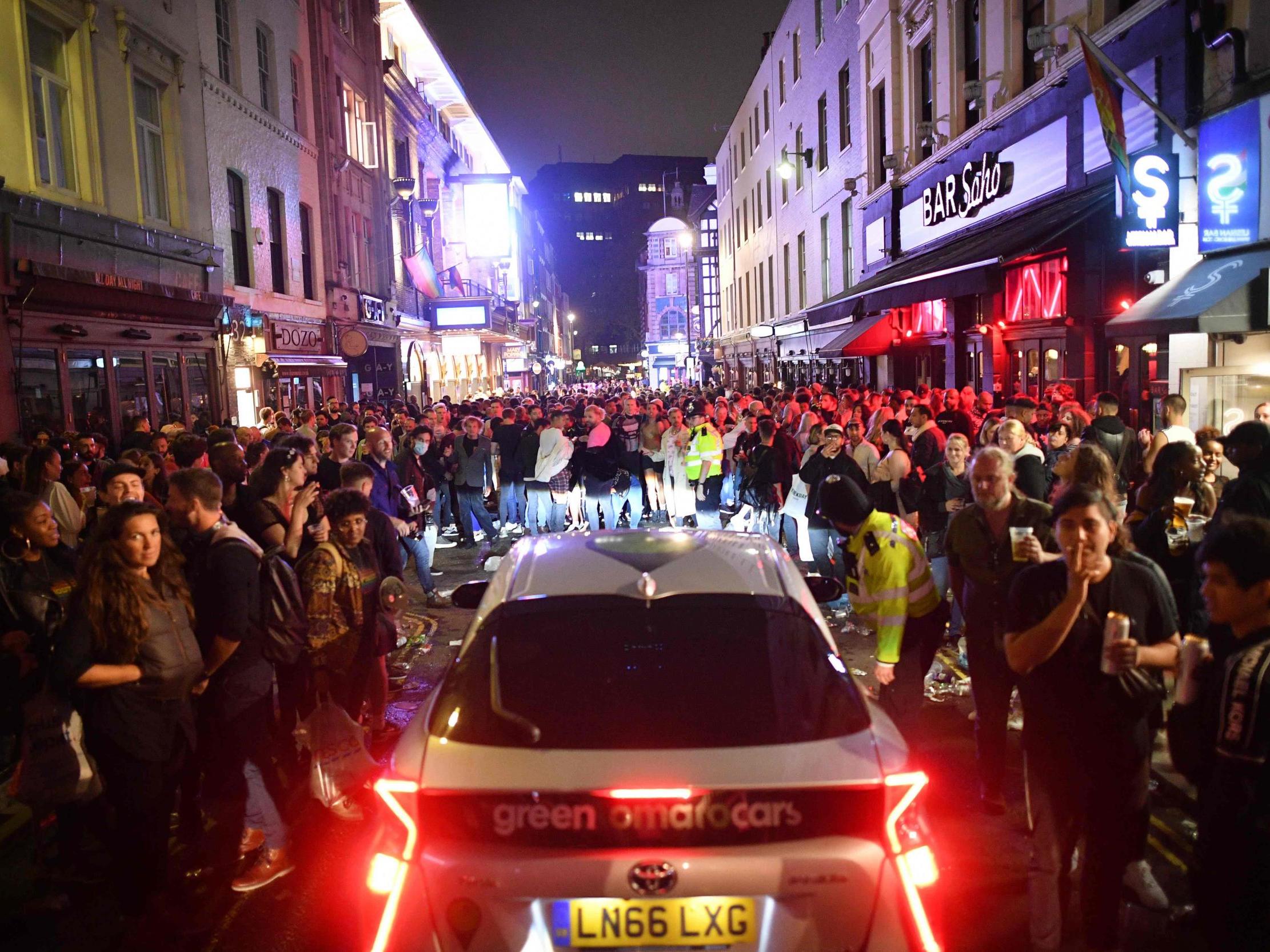Revellers struggle to distance in Soho on the first day pubs and bars were allowed to reopen in England since lockdown began