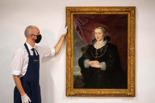 A Sotheby’s technician with the Rubens portrait, which was until recently hidden away in a private collection, unknown for much of the 20th century