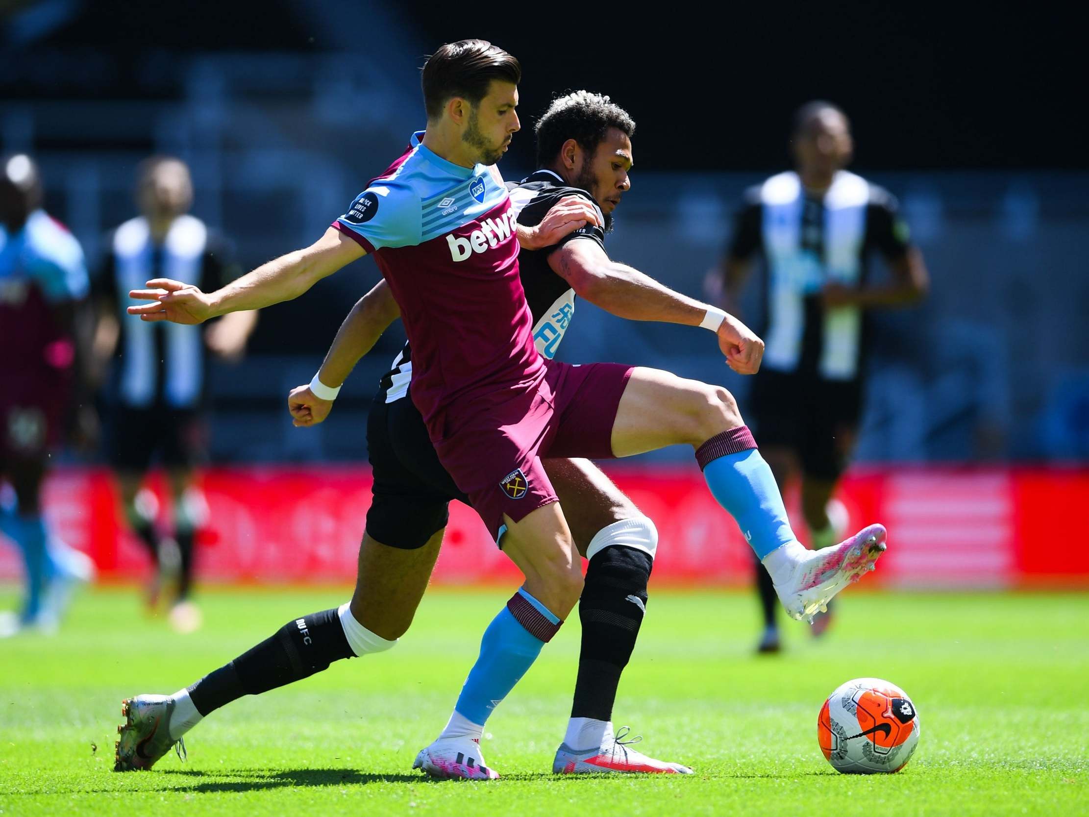 West Ham’s Aaron Cresswell battles for the ball